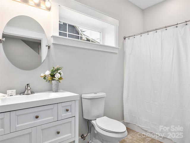 bathroom with vanity, tile patterned flooring, a shower with curtain, and toilet