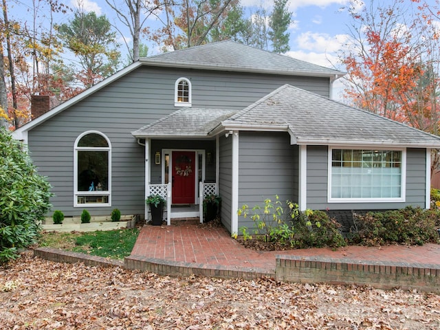 3 White Rock Ct, Arden, NC 28704 - traditional-style home featuring roof with shingles and a chimney