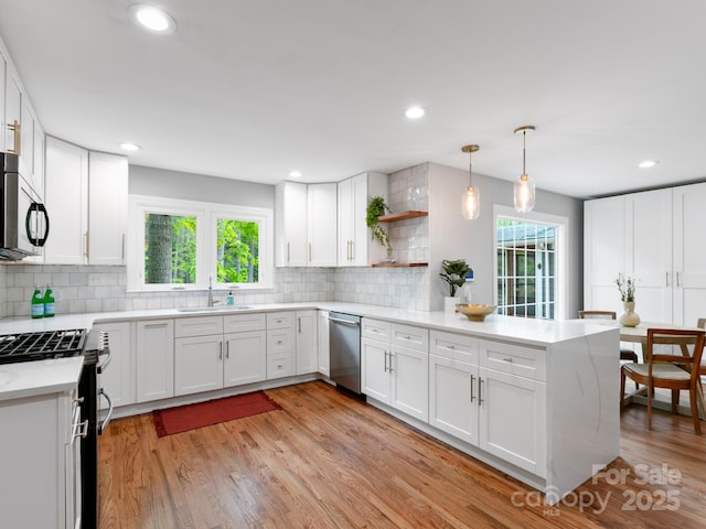 3 White Rock Ct, Arden, NC 28704 - kitchen featuring stainless steel appliances, a sink, a peninsula, plenty of natural light, and recessed lighting