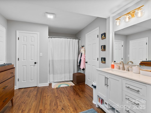 3 White Rock Ct, Arden, NC 28704 - bathroom with vanity, wood finished floors, curtained shower, and baseboards