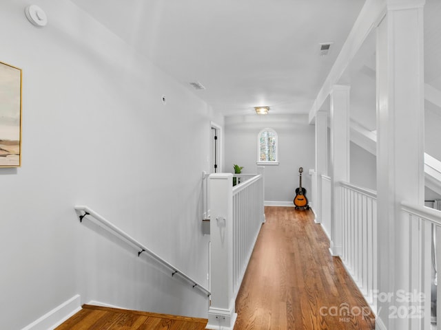 3 White Rock Ct, Arden, NC 28704 - hallway with an upstairs landing, wood finished floors, and baseboards