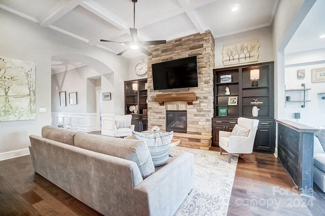 living room with a fireplace, beamed ceiling, wood-type flooring, and coffered ceiling