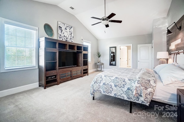 carpeted bedroom featuring ceiling fan and vaulted ceiling