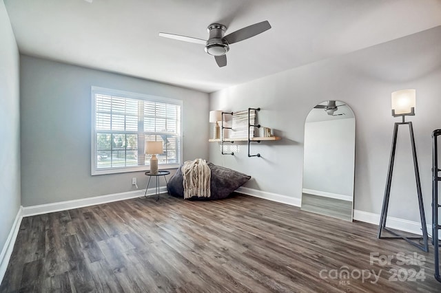 unfurnished room featuring ceiling fan and dark hardwood / wood-style floors