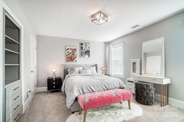 bedroom featuring light colored carpet