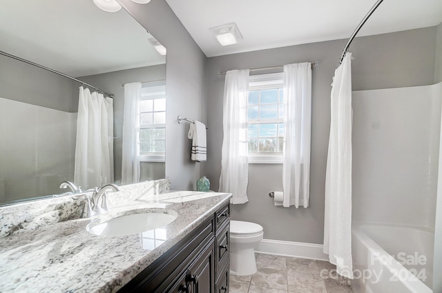 full bathroom with vanity, toilet, shower / bathtub combination with curtain, and plenty of natural light