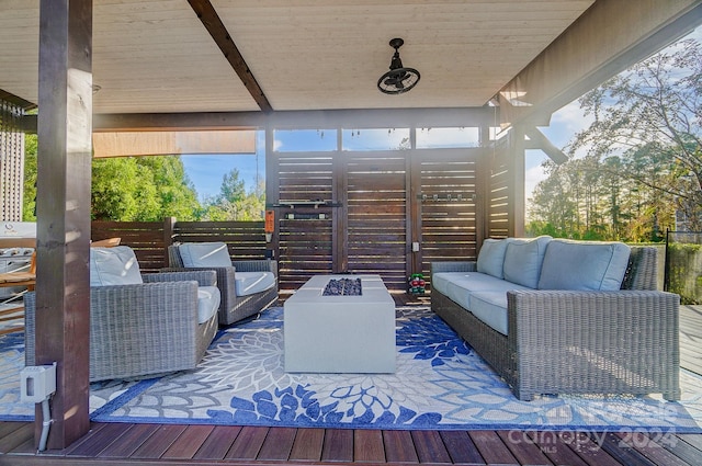 wooden deck with a gazebo and an outdoor living space