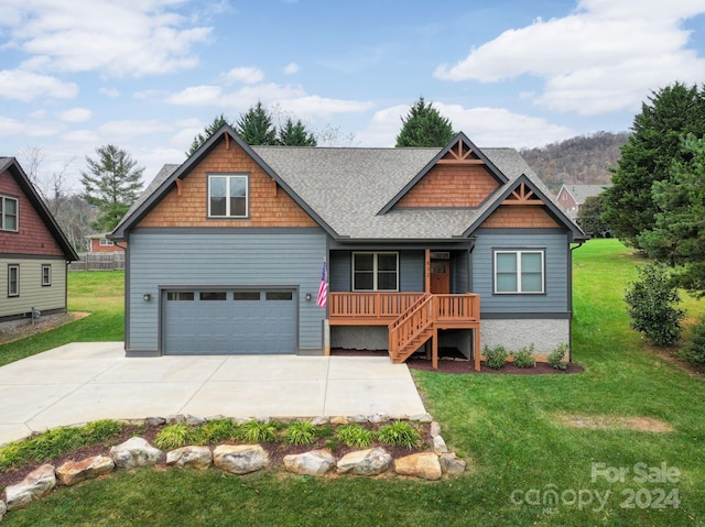 view of front facade with a garage and a front yard