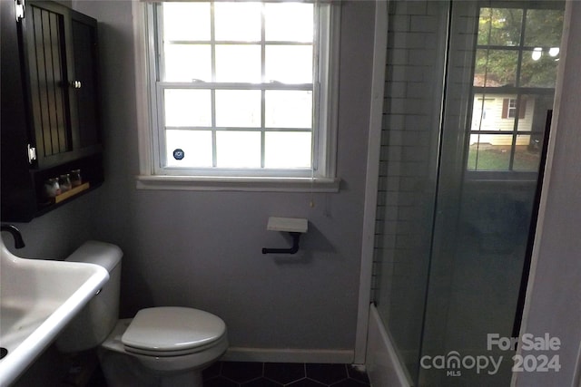 bathroom featuring toilet and tile patterned floors