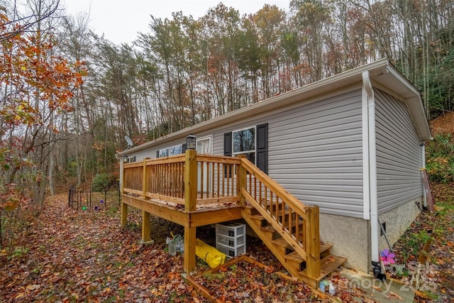 rear view of property with a wooden deck