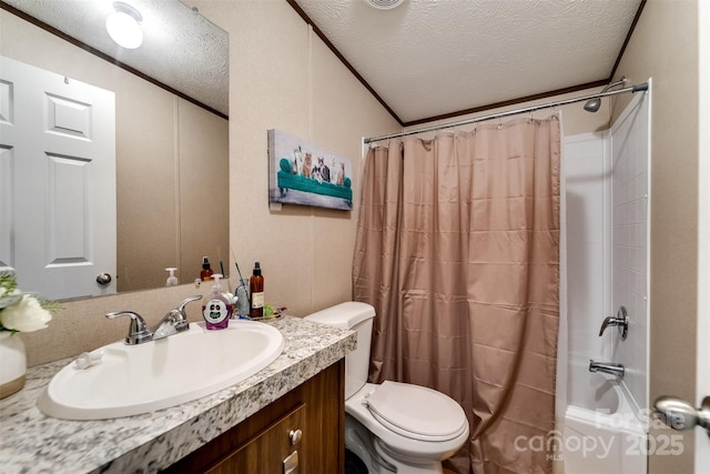 full bathroom with vanity, a textured ceiling, shower / tub combo with curtain, and toilet