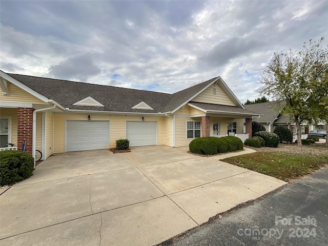 single story home featuring a garage