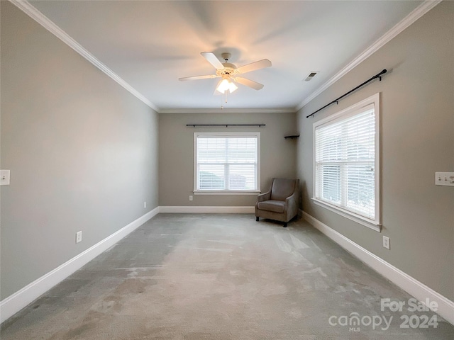 unfurnished room featuring ceiling fan, light carpet, and crown molding