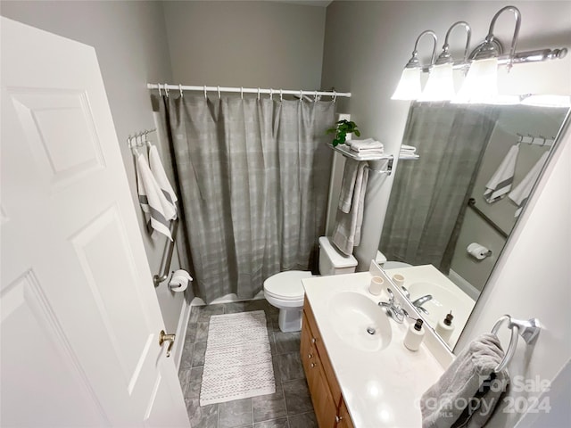 full bathroom with vanity, toilet, and shower / tub combo with curtain