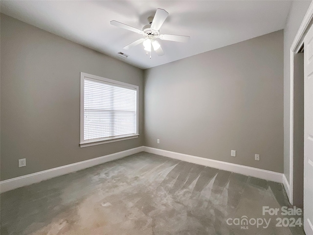 unfurnished bedroom with carpet and ceiling fan