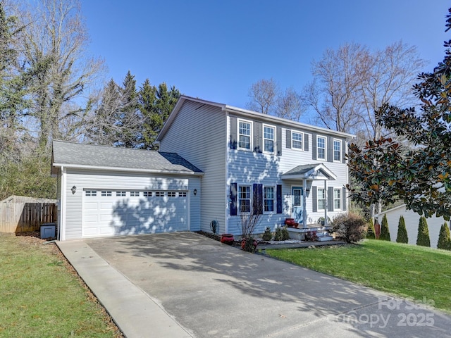 colonial house with a garage and a front yard