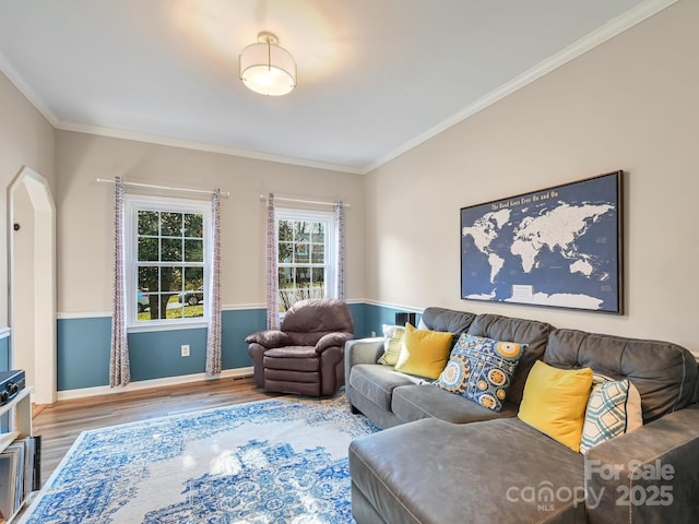 living room with hardwood / wood-style flooring and ornamental molding