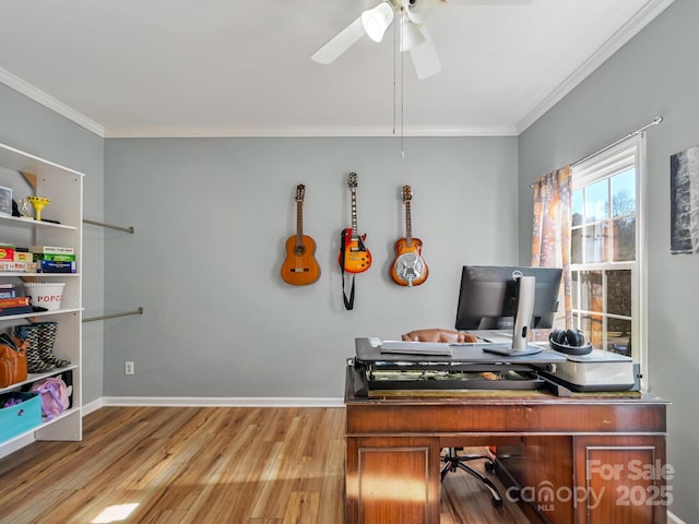 home office with crown molding, ceiling fan, and light hardwood / wood-style floors