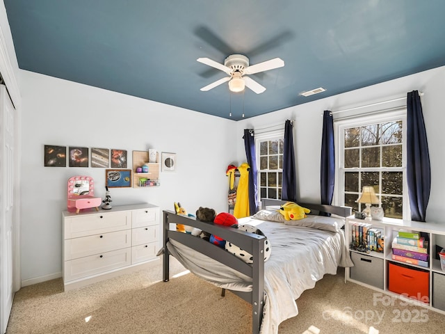 bedroom featuring ceiling fan and light colored carpet