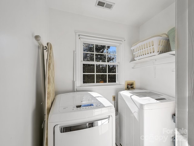 laundry room with washing machine and dryer