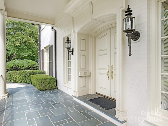 property entrance featuring covered porch