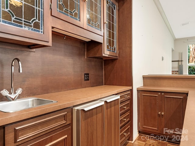 kitchen featuring sink and ornamental molding