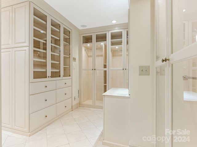 walk in closet featuring light tile patterned floors