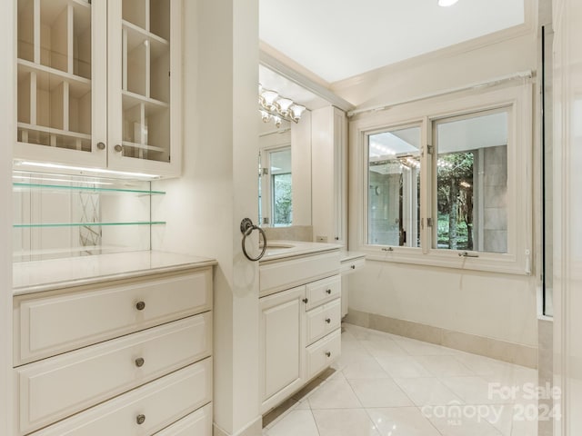 bathroom featuring tile patterned floors and vanity