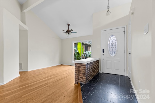 entryway featuring high vaulted ceiling, hardwood / wood-style flooring, and ceiling fan