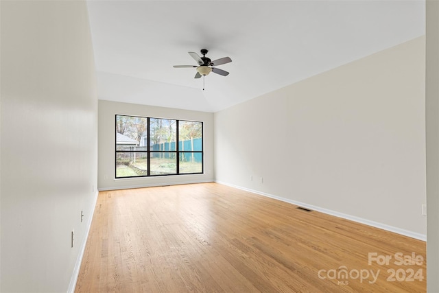 empty room with light wood-type flooring and ceiling fan