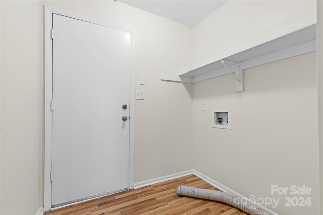 laundry room with hardwood / wood-style floors and washer hookup