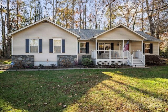 single story home featuring a porch and a front lawn