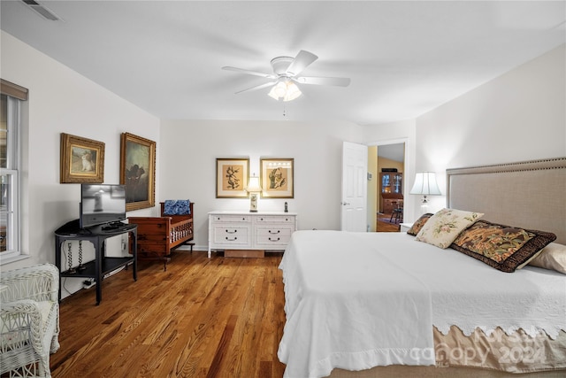 bedroom with hardwood / wood-style floors and ceiling fan