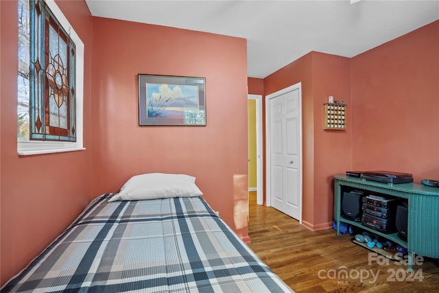 bedroom with hardwood / wood-style floors