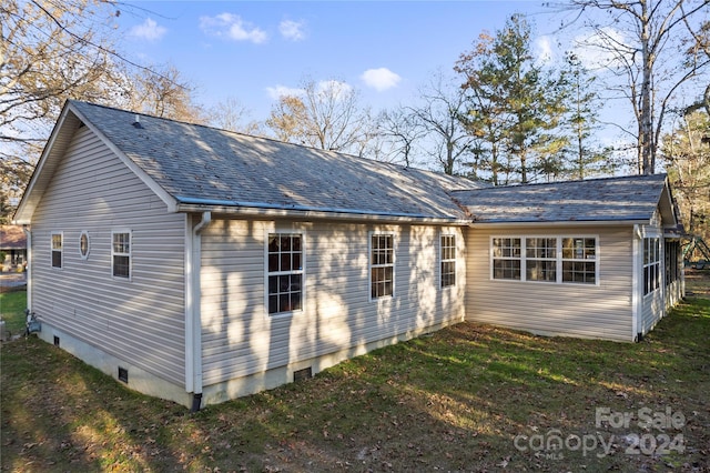 back of house with a yard