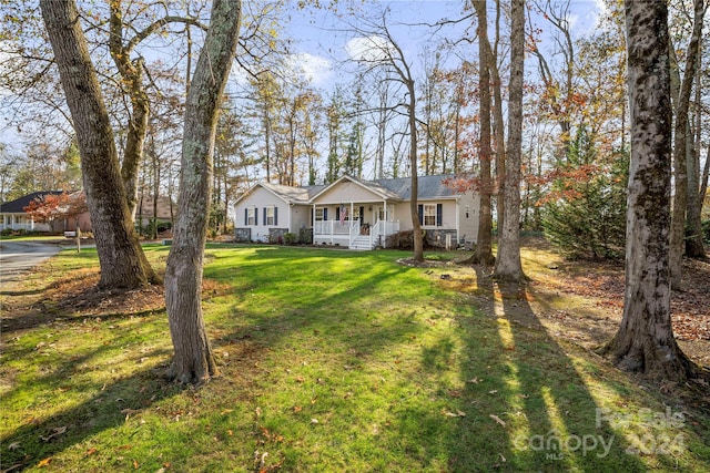 single story home with a front lawn and covered porch