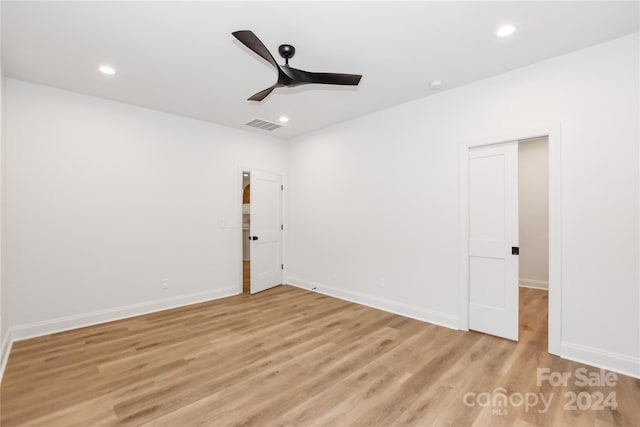 spare room featuring ceiling fan and light wood-type flooring