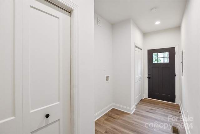 foyer entrance with light hardwood / wood-style flooring