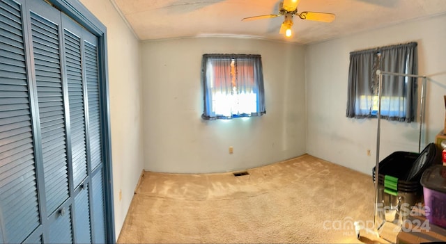 bedroom with light colored carpet and ceiling fan