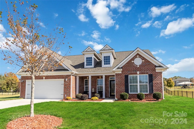 view of front of home featuring a garage and a front yard