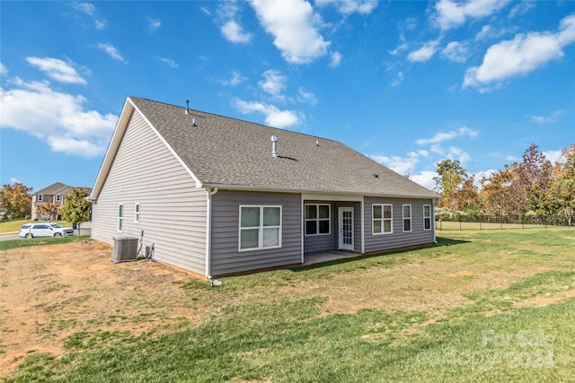 back of house with a patio, central AC, and a yard