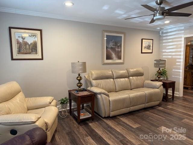 living room with ceiling fan, dark wood-type flooring, and crown molding