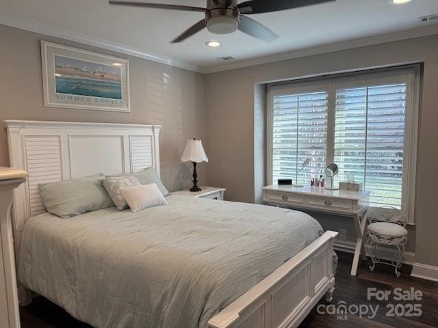 bedroom featuring dark hardwood / wood-style flooring, ceiling fan, multiple windows, and crown molding