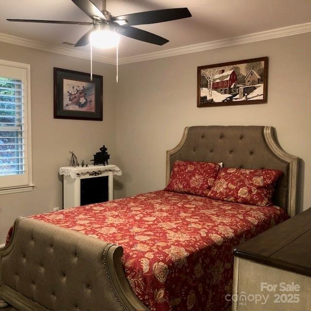 bedroom featuring ceiling fan and ornamental molding