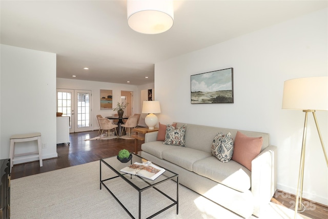 living room with baseboards, wood finished floors, and recessed lighting