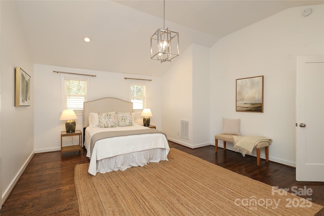 bedroom with visible vents, dark wood-type flooring, vaulted ceiling, a chandelier, and baseboards