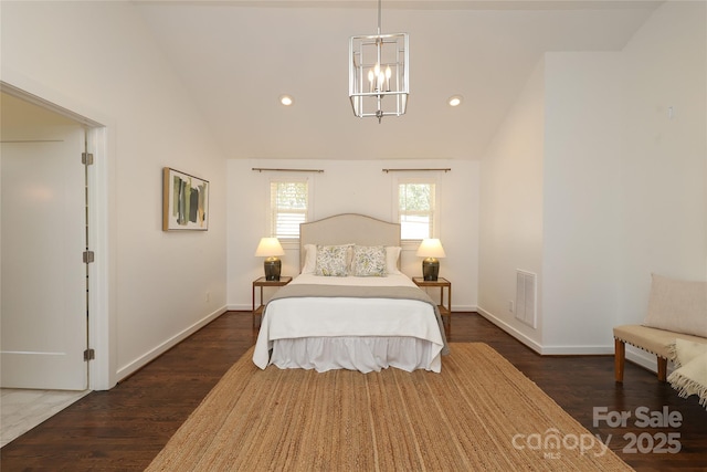 bedroom with dark wood-style floors, baseboards, visible vents, and vaulted ceiling