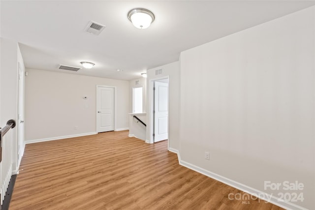 spare room with light hardwood / wood-style flooring