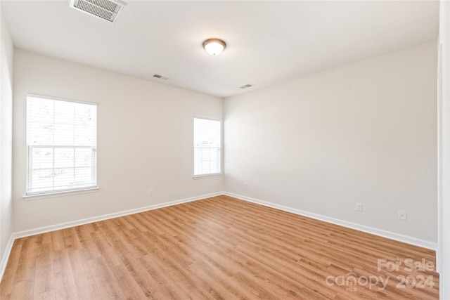 spare room featuring light hardwood / wood-style floors