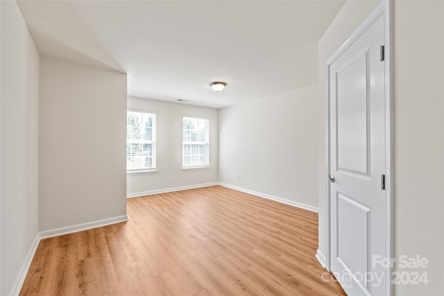 unfurnished room with light hardwood / wood-style flooring